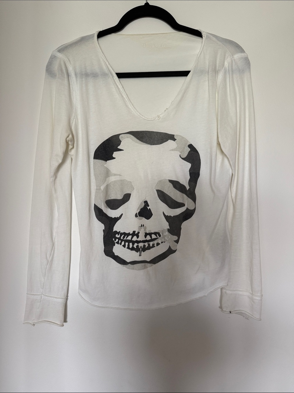 White Long-Sleeve V-Neck Top with Skull Graphic